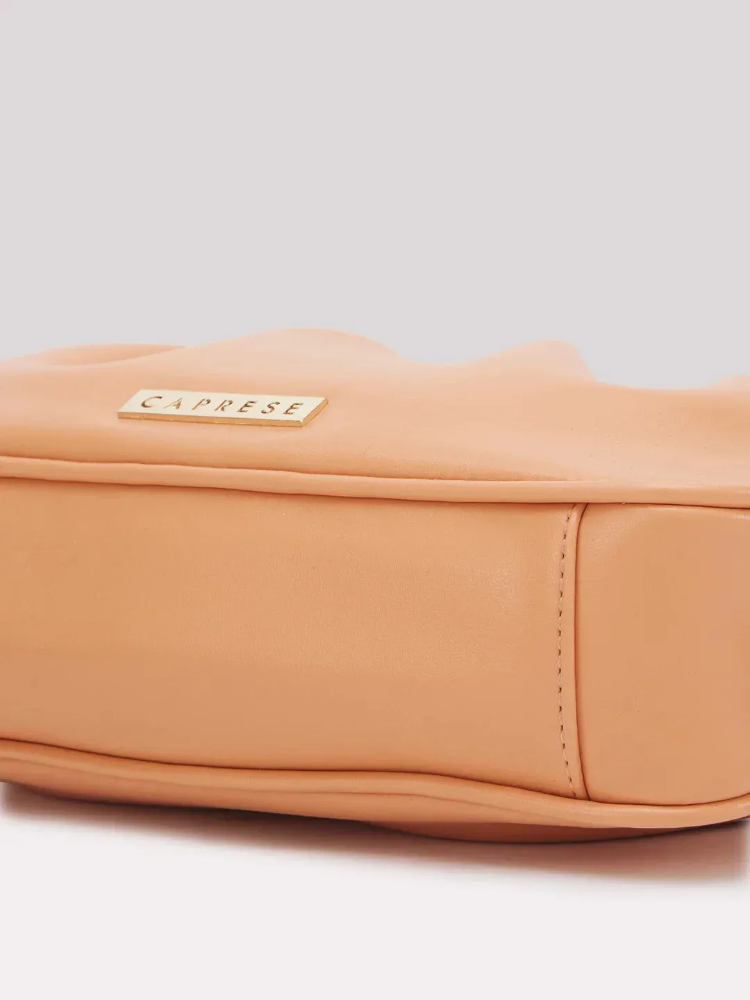Caprese Pierre Medium Peach Sling Bag