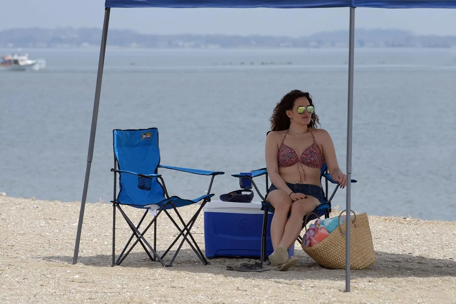 Quik Chair Portable Folding Chair with Arm Rest Cup Holder and Carrying and Storage Bag, Blue
